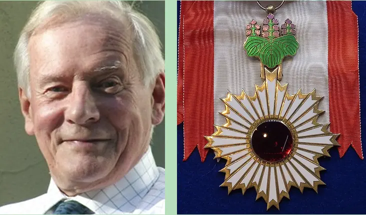 Photo of Michael Crawford next to a photo of the Order of the Rising Sun. He is late middle-aged, a friendly smile on his face, wearing a shirt and tie. He has white hair. 